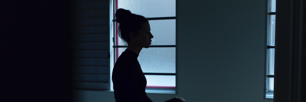 I Didn't Know I Was Sexually Assaulted woman sitting alone in a bedroom