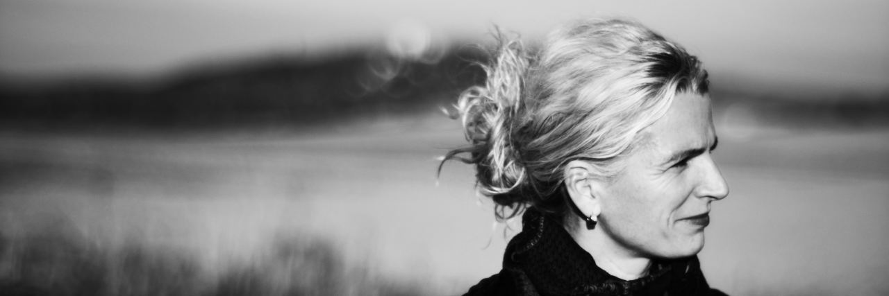 Still Grieving My Brother's Death as an Adult woman outside a lake