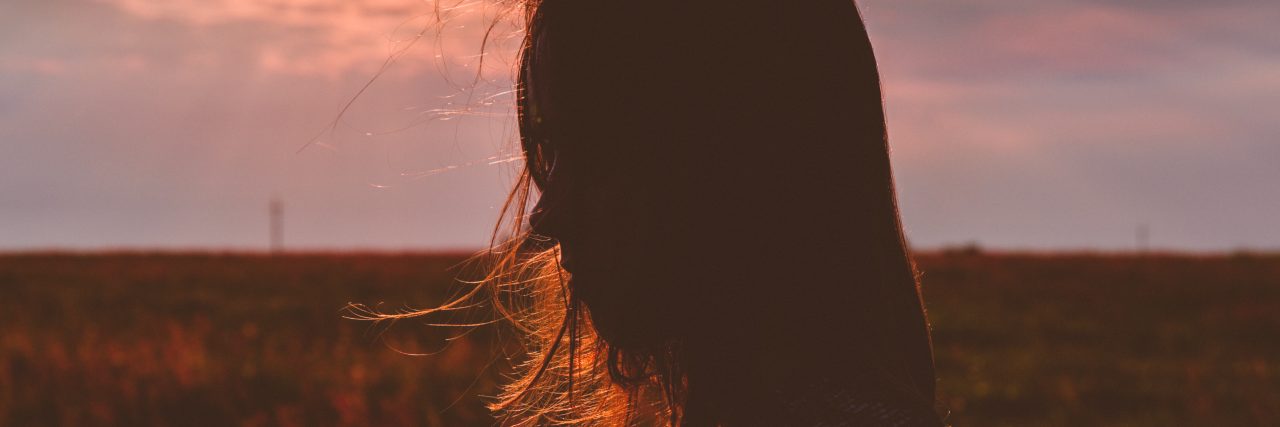 Listening to Music After My Son's Death by Suicide sad mom outside