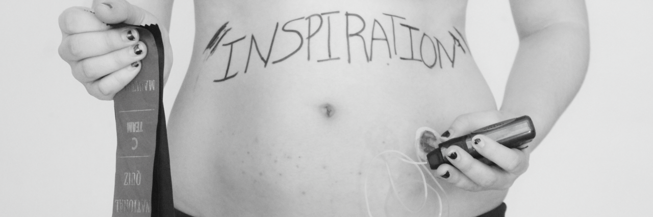 Type 1 Diabetes: Photos That Represent Life With an Invisible Illness black and white photo of a woman standing in her underwear giving herself an injection in her stomach with the word 'inspiration' written across her abdomen