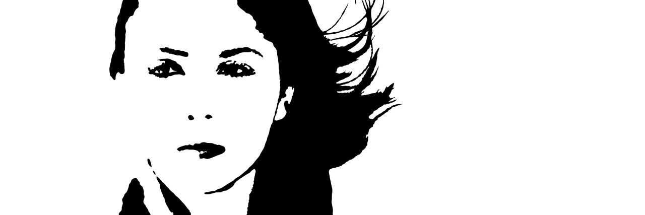 Learning to Accept Being Diagnosed With a Rare Disease black and white image of a woman with the wind blowing in her hair