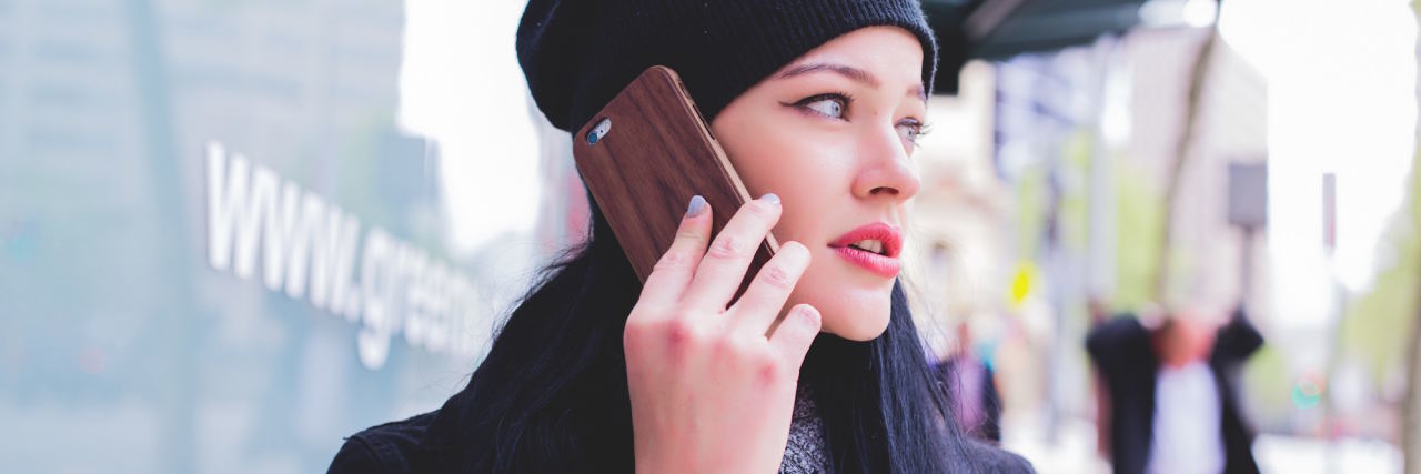 7 Ways to Support Someone Having a Panic Attack Over the Phone woman on phone
