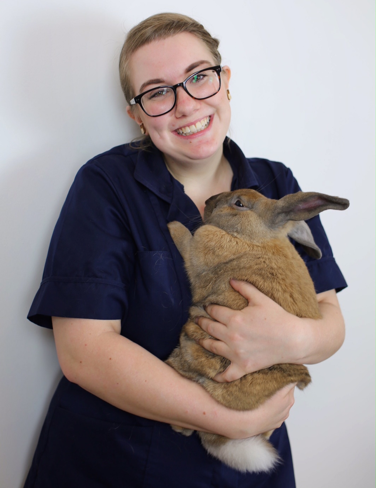 The writer holding a rabbit.