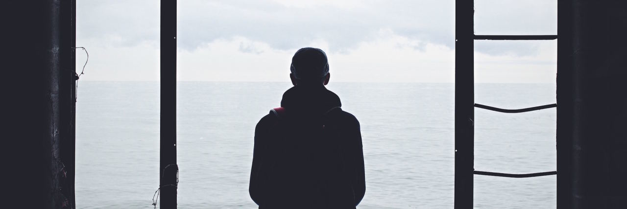Why We Shouldn't Treat Introversion Like a Mental Illness man looking out window