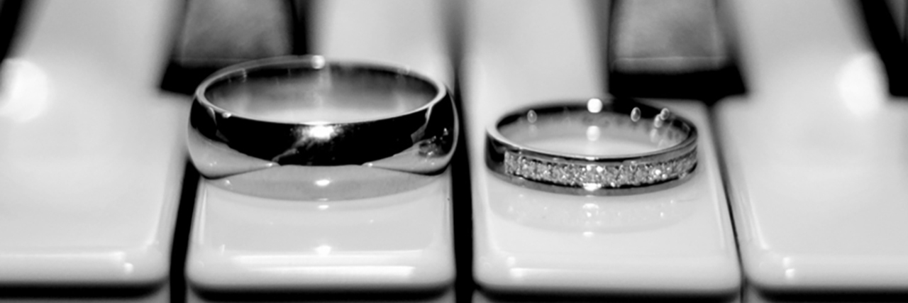 Wedding rings on a piano.