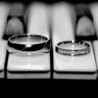 Wedding rings on a piano.