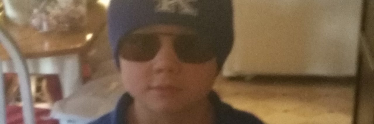 Do You Know What the Laws Are In Your State? Little boy wearing blue shirt and blue beanie