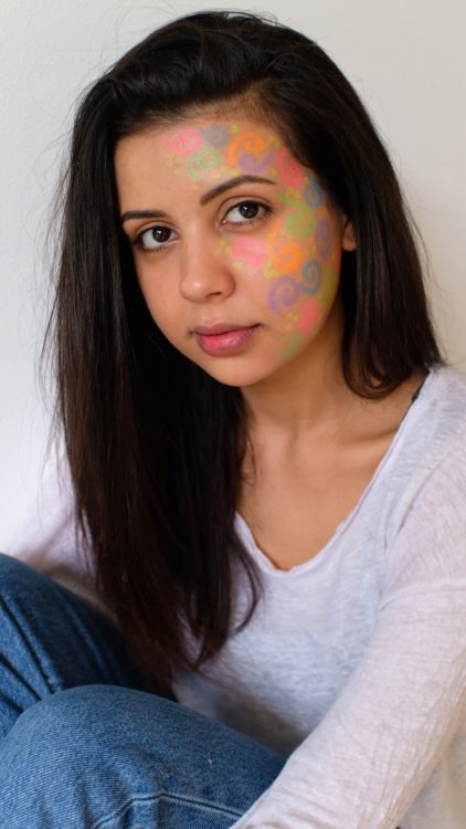 the author with "rare" colors painted on her face for rare disease day