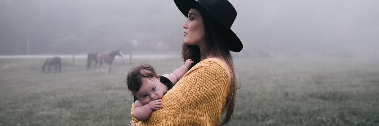 Undiagnosed BPD Stole My First Few Years as a Mom woman with baby