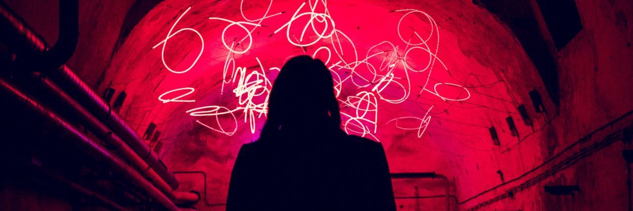 These Are the Intense Emotions of My Borderline Personality Disorder shadow of person in red, light-filled tunnel