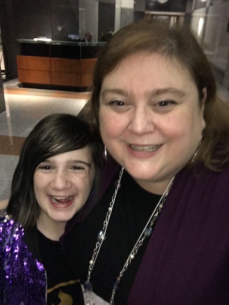 mother and daughter dressed up at a concert