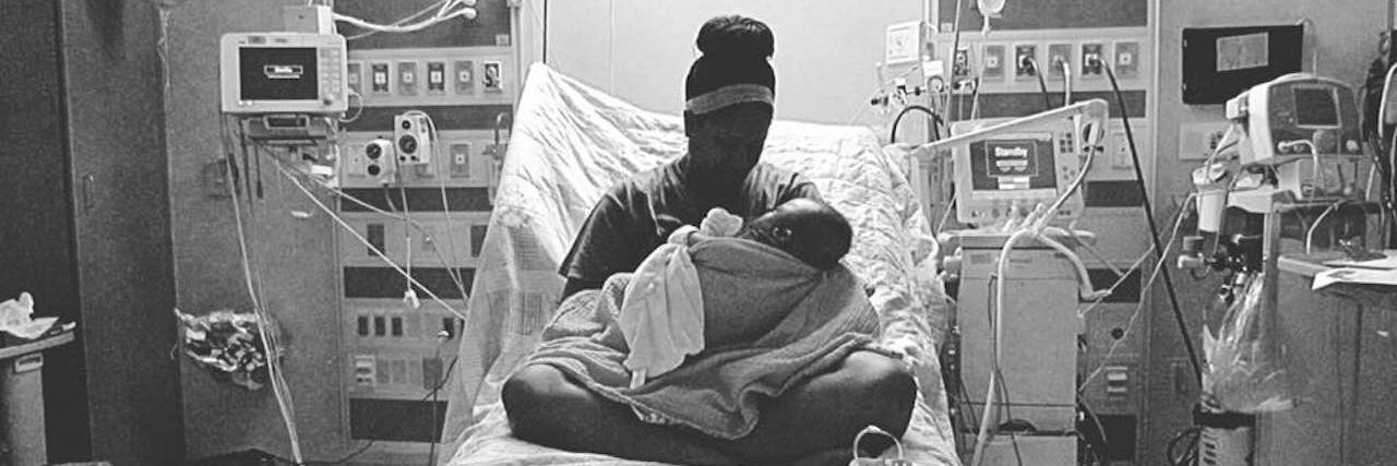 Finding Strength in an Uber When Asked, 'Do You Have Children?' mom holding her baby in a hospital bed