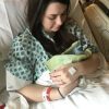 Mother holding baby in hospital