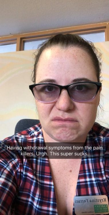 woman wearing a plaid shirt and tinted glasses frowning with a caption over the picture that says 'having withdrawal symptoms from the painkillers. ugh. this super sucks'
