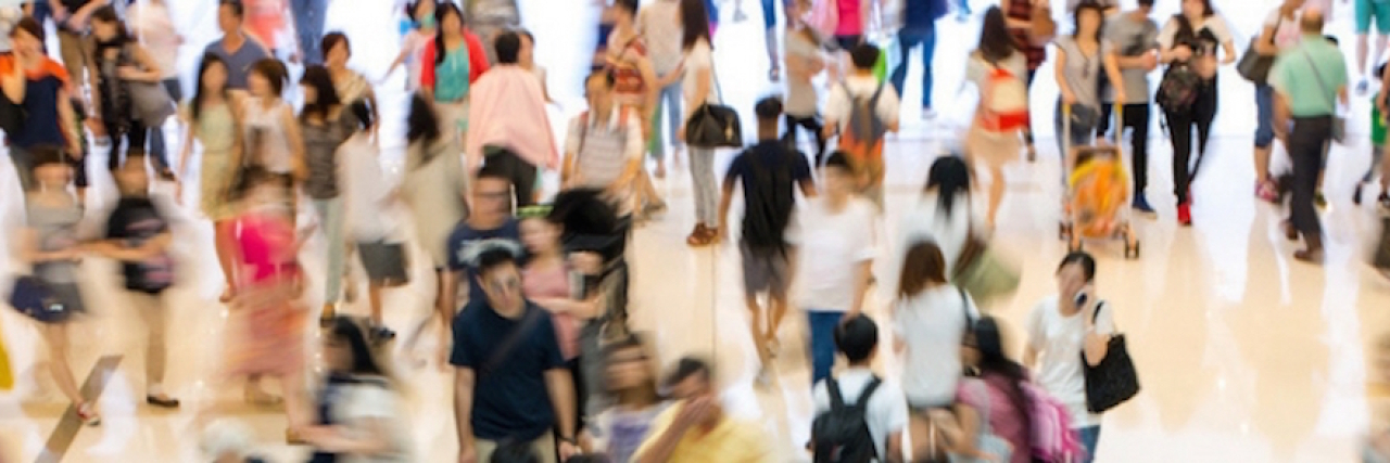 What People Do When They're Anxious in Public A crowded place. Text reads 25 Things People Don't Realize You're Doing Because You're Anxious in Public