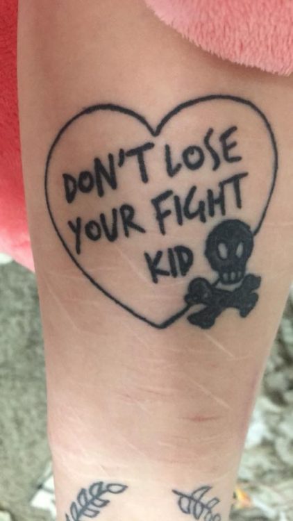 tattoo that reads: Don't lose your fight kid