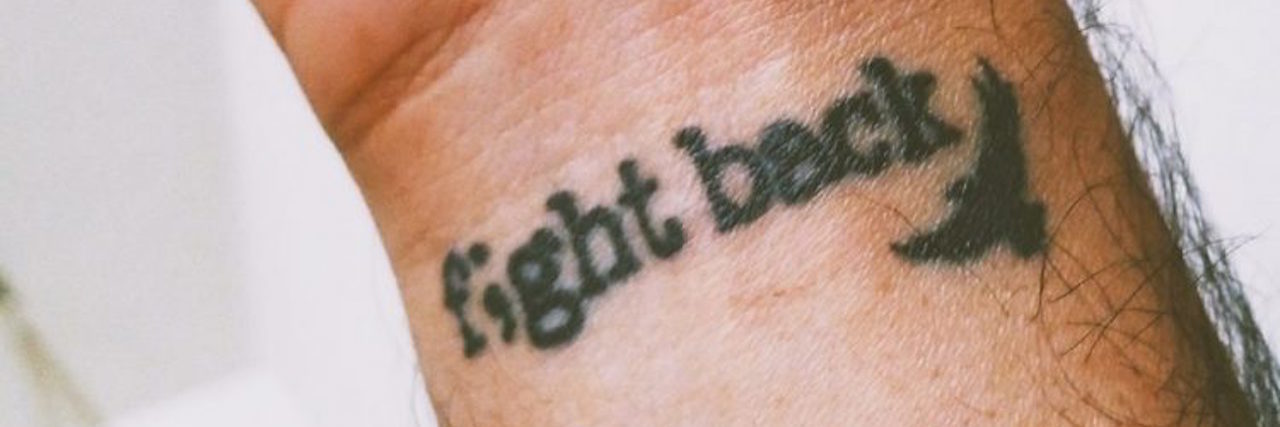 31 Tattoos That Give Us Hope for Self-Harm Recovery Tattoo on a wrist that reads "Fight back"