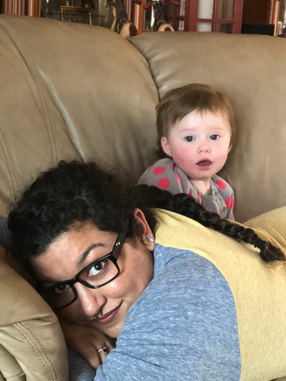 woman lying on couch with baby