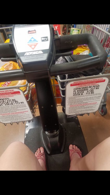 sitting on electric grocery store cart