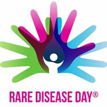 World Rare Disease Day logo with different colored hands interlocking 