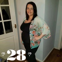 woman posing at 28 weeks pregnant