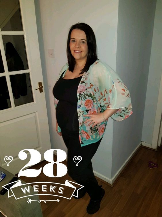 woman posing at 28 weeks pregnant
