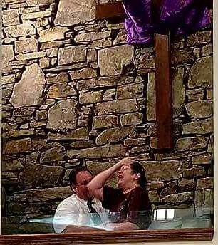 woman getting baptized at her church