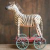 Zebra toy on wheels.