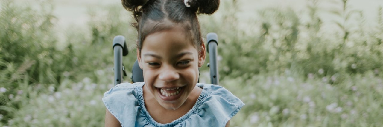 I Want Accessibility for My Daughter Who Uses a Wheelchair Cute girl with pigtails sitting on her wheelchair and smiling