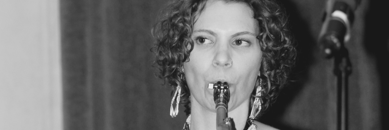 When the Performance of Your Disease Affects Your Musical Performance A photo of the writer playing the saxophone.