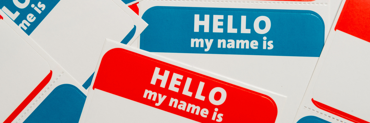a stack of red and blue 'hello, my name is' stickers