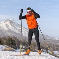 Man with prosthetic leg skiing.