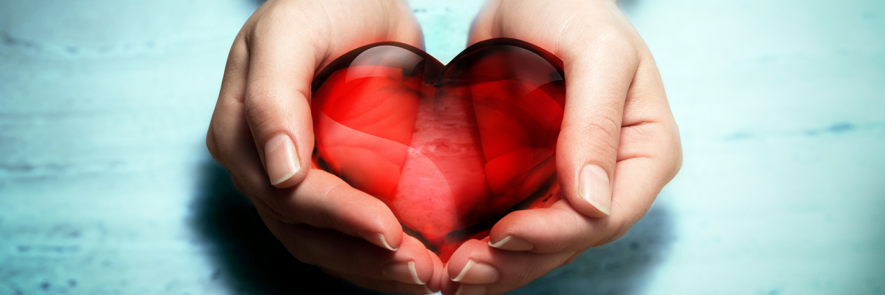 Chemo Care Package Ideas hands holding a crystal heart