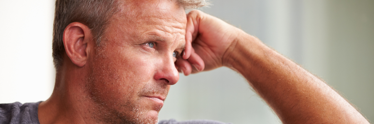 Mature Man Suffering From Depression At Home