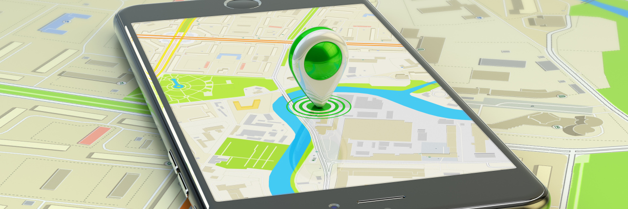 How EVV Violates the Rights of People With Disabilities Smartphone with marker on map.