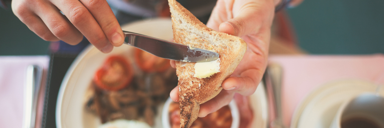 5 Disordered Food Habits That Might Be Affecting Your Mental Health Closeup on a young woman's hands as she is having breakfast
