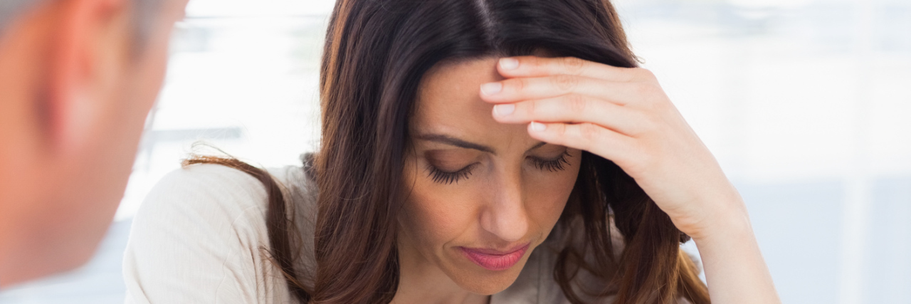 When I Knew More About My Illness Than My Doctors An upset woman in a doctor's office talking to her doctor.