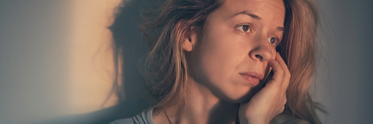 When Every Day Feels Like a Really Long Day With Depression Woman alone and depressed in sunset light.