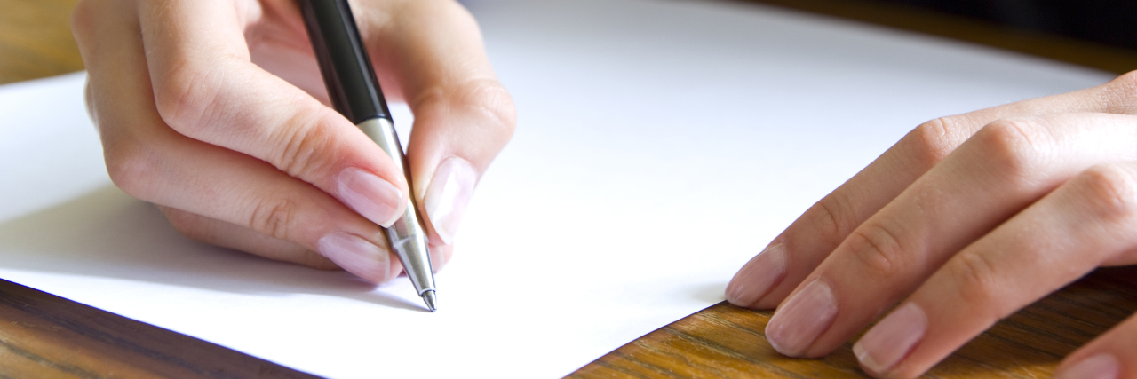 A Letter to the Parents of a Child With FPIES closeup of female student writing a letter