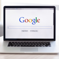 MacBook Pro Retina with Google home page on the screen