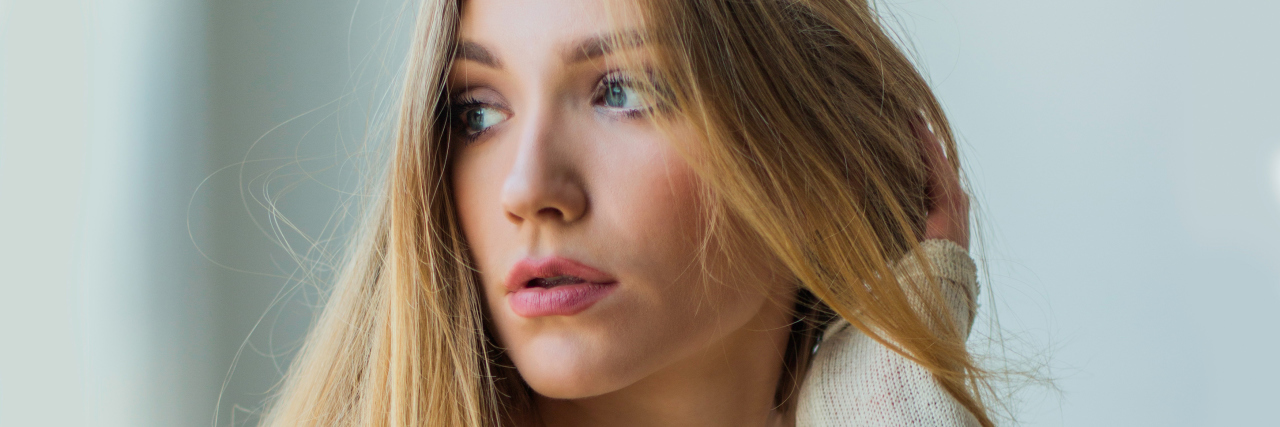 What to Know About Endometriosis woman with blonde hair looking away