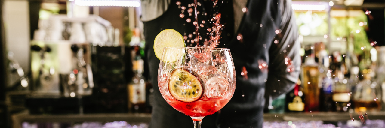 What It's Like to Be a Bartender With Borderline Personality Disorder bartender making cocktail in night club