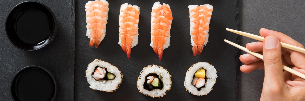 How Sushi Relates to My Upcoming Heart Transplant A picture of a man with a plate of sushi in front of him.