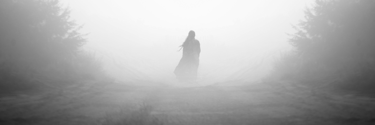 My Biggest Fear About Life With Chronic Pain A photo of a person standing in the midst of fog.