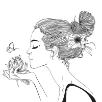 black and white image of a woman holding a flower and smelling it
