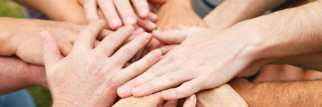 Disclosing Mild Cerebral Palsy to Friends and Family Human hands showing unity.