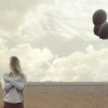lonely woman with blacks balloons hid her face