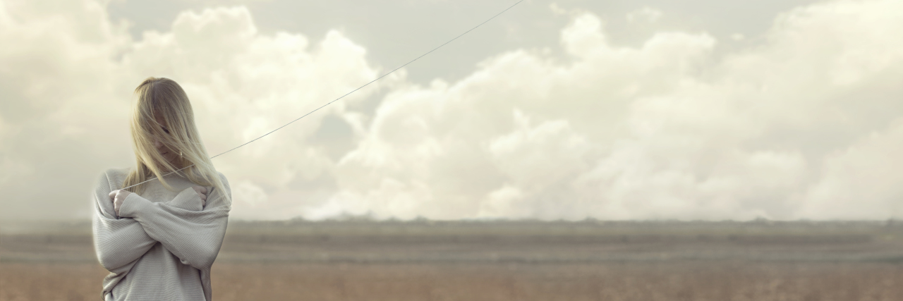 4 Things I Want You to Know If You're Feeling Suicidal Right Now lonely woman with blacks balloons hid her face