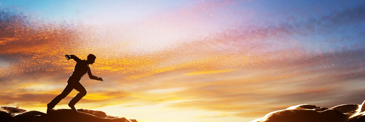 Being Brave as a Man With Autism Man running fast to jump over precipice.