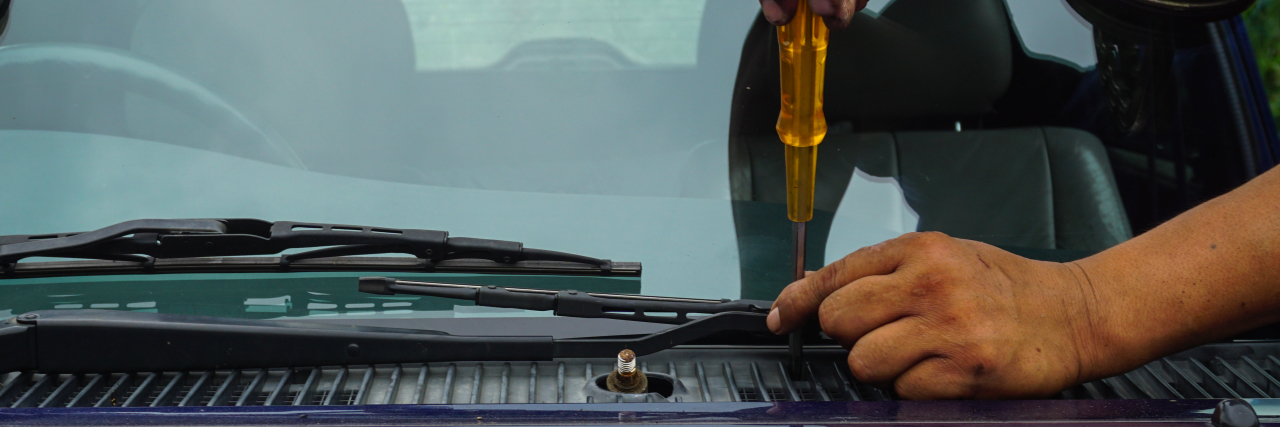 Repairing car windshield.